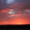 sunrise looking east at Cloud County Community College wind turbines