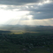 Sun breaking over Eagar from Flat Top Mountain