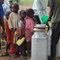 Local kids line up for fresh milk, Sep 2008