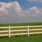 white fence and clouds
