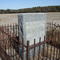 monument at former Dobbs County courthouse site, protected by rusty, damaged old fence, near Seven Springs, NC, 11-23-08