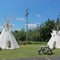 Tipis in Big Boy (restaurant)'s yard near Indian Lake/Kitch-iti-kipi