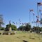 flags flying around Statue of Liberty reproduction, Lacrosse, KS