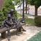 Storybooks, life-size bronze of mother, boy and girl reading, Lyons, KS