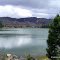 USA, ROCKY MOUNTAINS - Big Lake near Lave Springs State Park and remains after lavaflow