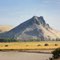 Malheur Butte (looking northeast) Volcanic plug exposed from sediment by river.