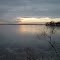 Dec 2004 - Worthington, Minnesota. Winter sunset clouds reflecting on the frozen Lake Okabena.