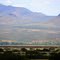 Steel fence separating Mexico (in background) from USA.