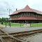 Hamlet Crossing with Depot in Background---st