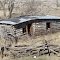 Log Building with Car Roof