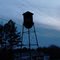 Society Hill Water Tower with birds at sunset