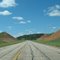Red dirt hills before the curve