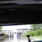 Canoe sailing under the Hwy 7 bridge between the two halves of Inguadona lake