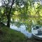 boat docked by campsite