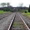 RailRoad Tracks Leading Somewhere...Looking West...The Timbers Showing Their Age And In Need Of Repair......(1622394350)