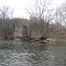 an abandoned bridge column catches debree