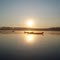 Sun coming up over War Canoes