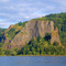 Crown Point from the Columbia River.  The Vista House, a combination information center and viewpoint, sits on the crest.  Rooster Rock is in the lower right.