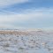 A Vast Prairie Landscape And Sky With Distant Mountains In First Peoples Buffalo Jump State Park Near Great Falls Montana Jan '12