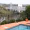 Pheasant Coucal beside the pool. Walter Taylor Bridge in the background. Indooroopilly, Queensland