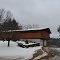 House that looks like a covered bridge.