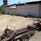 Goat pen with old farm machinery to climb on---st