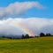 Rainbow and Clouds Shrouding Tongariro by Scott McLachlan