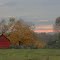 Sunrise over red barn