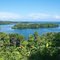 Green island in the blue bay