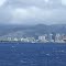 HAWAII - View of Honolulu Harbor featuring Honolulu hotels, businesses, mountains and city scape.