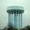 Green tree water tower