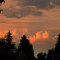 Contrasting Skies - Peaceful, Painted Puffy Clouds in the Foreground, Dark, Distant Storm Clouds in Behind, Edmonton AB