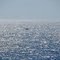 Lonely boat in the endless blue
