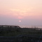 Walking towards the sunrise to the beach