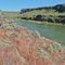 The Snake River just north of Murtaugh, Idaho. Red grass is ripening cheat grass.