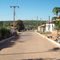 Rua periférica de São Miguel do Tocantins, e ao fundo os típicos babaçuais do norte do estado do Tocantins. Agosto/2010.