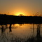 Por do sol em lago do rio suiá
