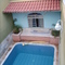 Casa com piscina na rua Hernestina