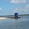 Ponta de praia entre o rio e o mangue, onde existe um barzinho que só se chega de barco.