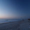 Sunrise on the beach with a cresent moon