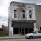 Old building in Nevada, MO still carrying the name of the store 'Harry Moore Dry Goods Co' that closed in 1885