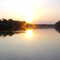 Por do sol sobre a balsa do rio  Manuel Alves