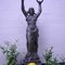 statue holding torch and wreath