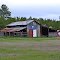 Texas pride shown on this barn.(note bicycles on roof)