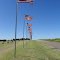 flags flying at Lucas Cemetery, Lucas, KS