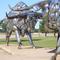 Two Steers  by John Kearney, also called Bumper Bulls, 2 life-size bulls made of vehicle bumpers, Kansas Coliseum, Wichita,KS