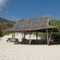Several grass hut sitting areas