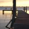 Sunlight lights a dock on Lake Santa Fe