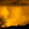 Golden sun set with rain clouds