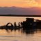 A cane raft docks with a steam ferry, Oakland, Dibrugarh